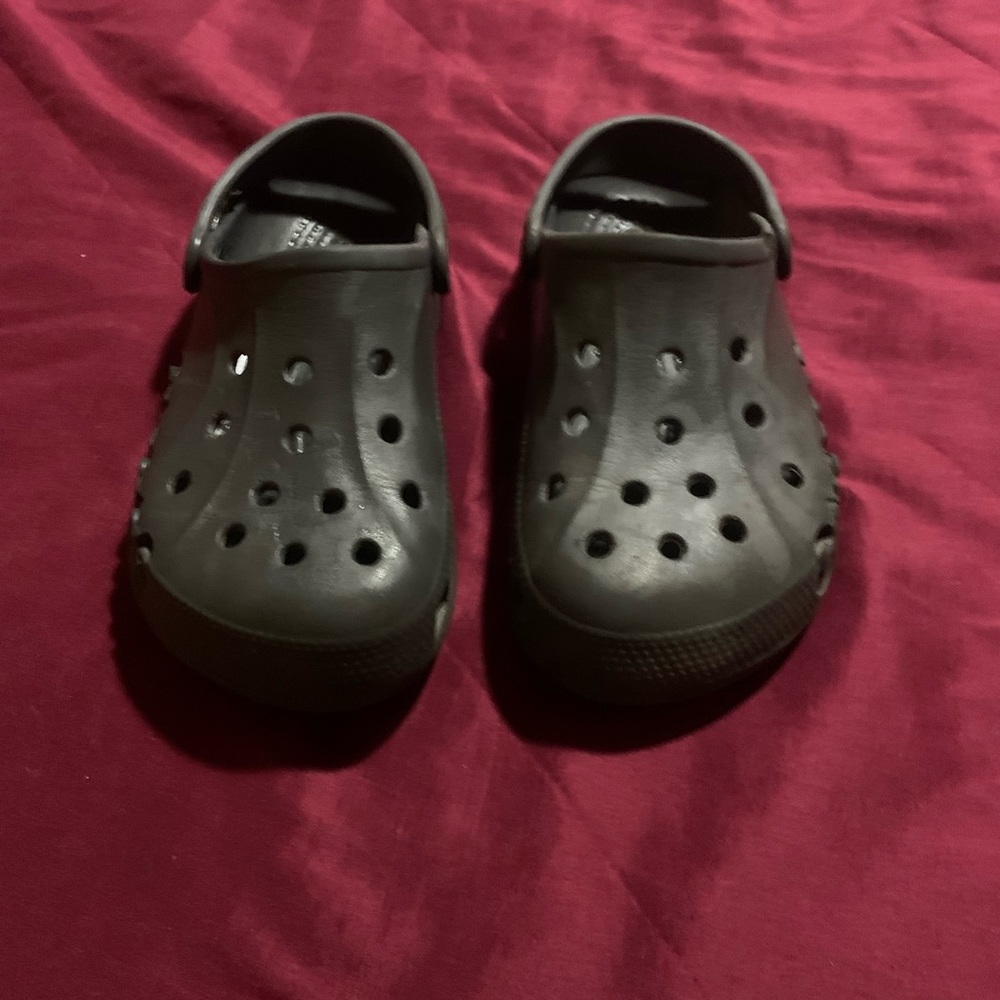 Dark Gray Crocs.